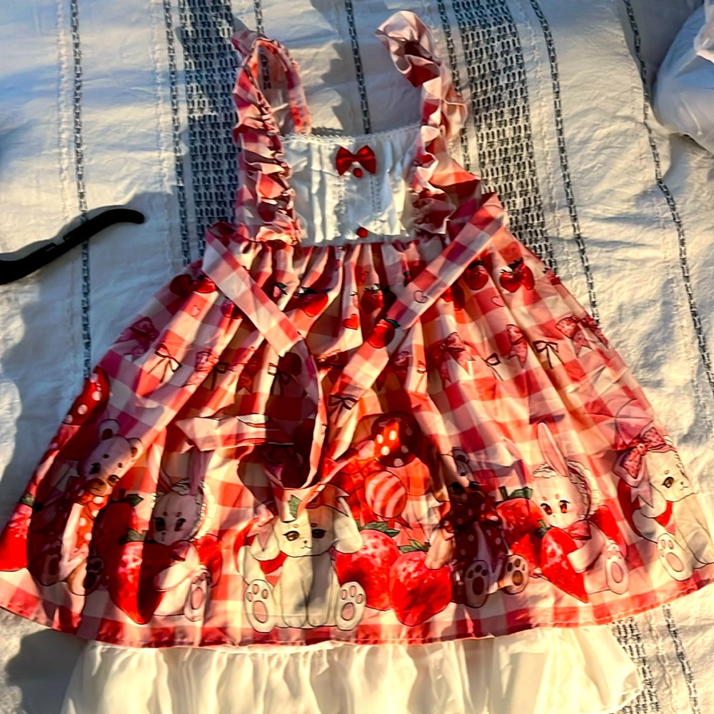 Cute Lolita dress, it is pink and red with bunnies on the bottom very cute